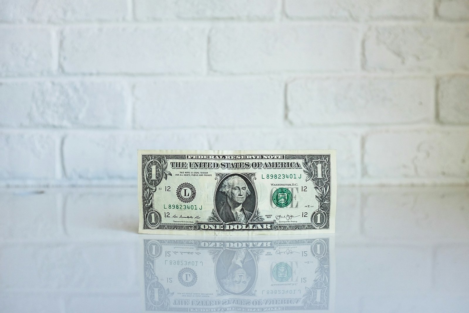 1 U.S. dollar banknote on white surface